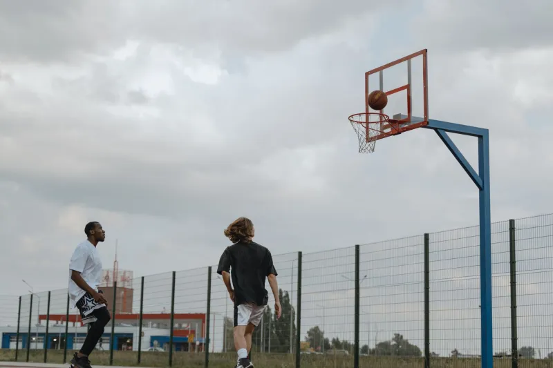 Open Layups in Broad Daylight: The Hidden Cost of Chasing Elite Three-Point Shooters
